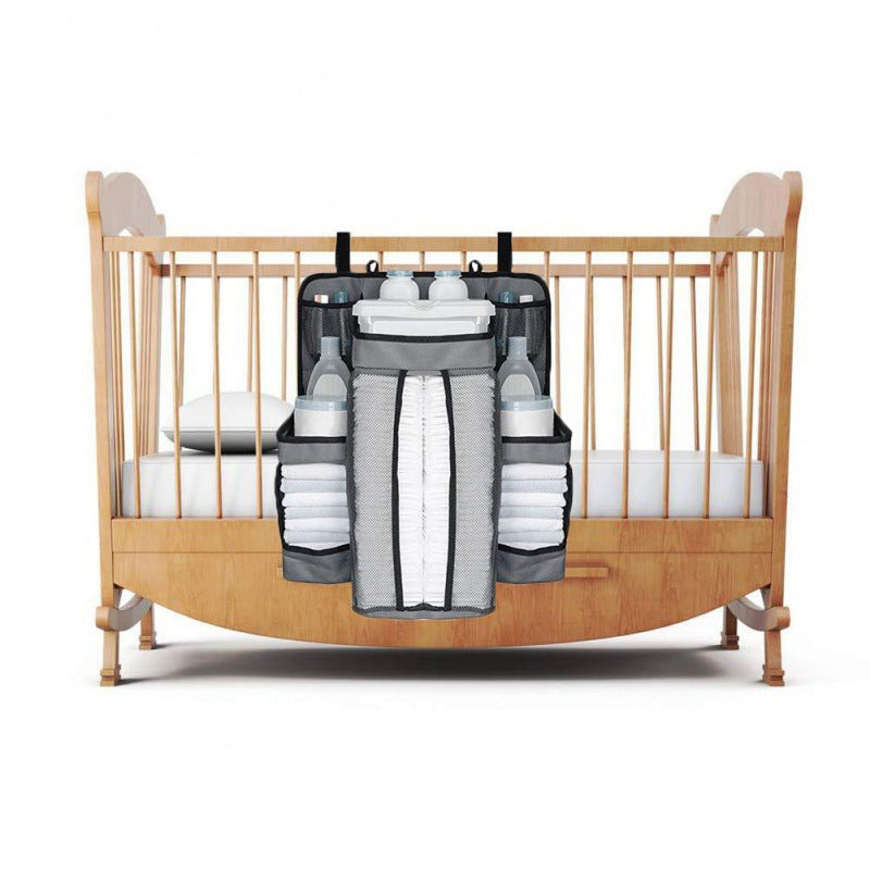 Organiser strapped to cot rail